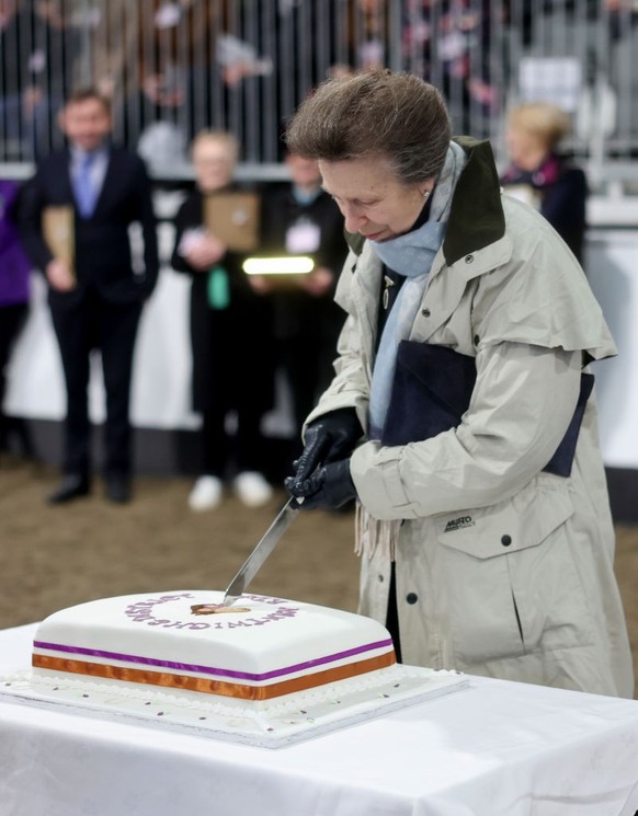 NANTWICH, ENGLAND - JANUARY 30: Princess Anne, Princess Royal cuts a cake during the opening of the Reaseheath Equestrian College on January 30, 2024 in Nantwich, England. (Photo by Chris Jackson/Gett ...
