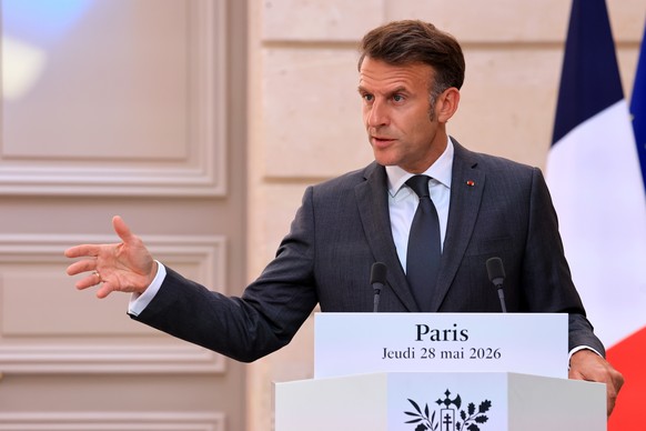 epa13000647 France's President Emmanuel Macron speaks during a joint press statement with Indonesia's President Prabowo Subianto (not pictured) at The Elysee Presidential Palace in Paris, Fr ...