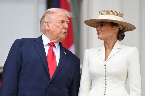 WASHINGTON, DC - APRIL 28:U.S. President Donald Trump and First Lady Melania Trump pose on the balcony of the White House during a state arrival ceremony on the South Lawn of the White House on day tw ...