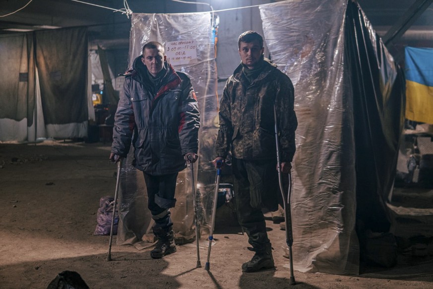 epa09940179 A handout picture made available by Regiment Azov press service shows an injured Ukrainian serviceman in a shelter at the Azovstal Iron and Steel Plant in Mariupol, Ukraine, 10 May 2022 (i ...