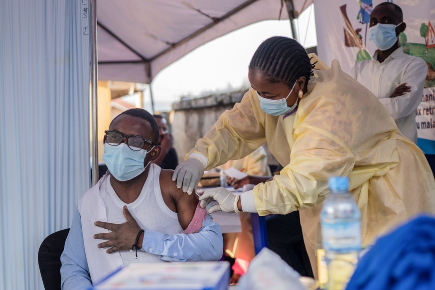 epa11644018 A medical staff receives a vaccine for smallpox and mpox, made by Danish drugmaker Bavarian Nordic, in a symbolic start of the mpox vaccination campaign at Goma General Hospital, in Goma,  ...