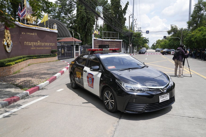 A police car blocks the Army Training Command compound which houses the Army War College in Bangkok, Thailand, Wednesday, Sept. 14, 2022. A military clerk allegedly shot at his co-workers at the Army  ...