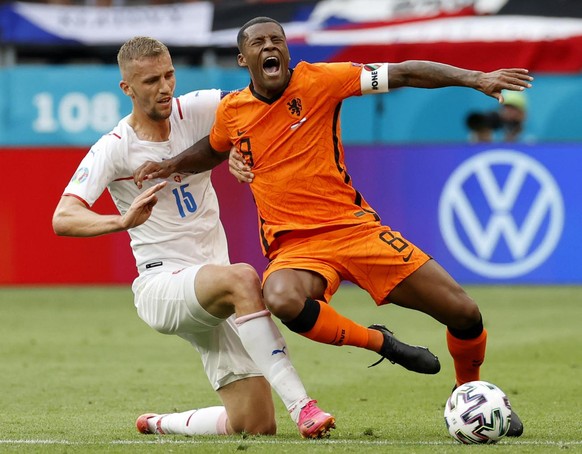 Czech Republic&#039;s Tomas Soucek, left, challenges Georginio Wijnaldum of the Netherlands during the Euro 2020 soccer championship round of 16 match between Netherlands and Czech Republic at the Fer ...