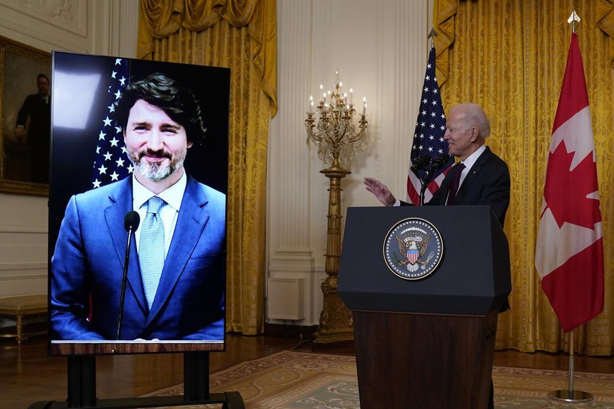 President Joe Biden speaks after holding a virtual meeting with Canadian Prime Minister Justin Trudeau, in the East Room of the White House, Tuesday, Feb. 23, 2021, in Washington. (AP Photo/Evan Vucci ...