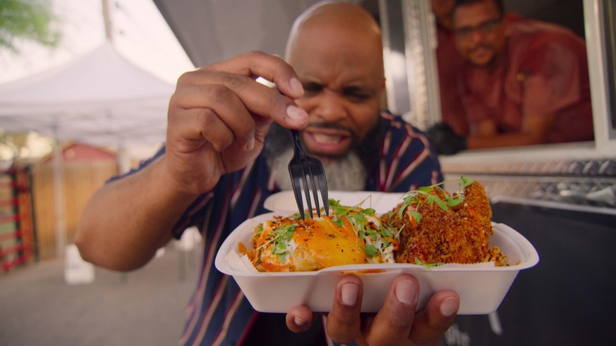 Fresh, Fried &amp; Crispy: Season 1. Episode 3, “Las Vegas”Pictured: Daymon Scott “Daym Drops” Patterson (Food Critic) tasting the Hakka Street Noddles (pork tonkatsu, shrimp and fried egg) by chef Ma ...