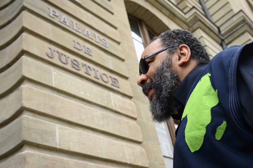 epa09323153 French humorist Dieudonne MBala MBala arrives at the courthouse prior to his trial for racial discrimination, in Geneva, Switzerland, 05 July 2021. EPA/LAURENT GILLIERON