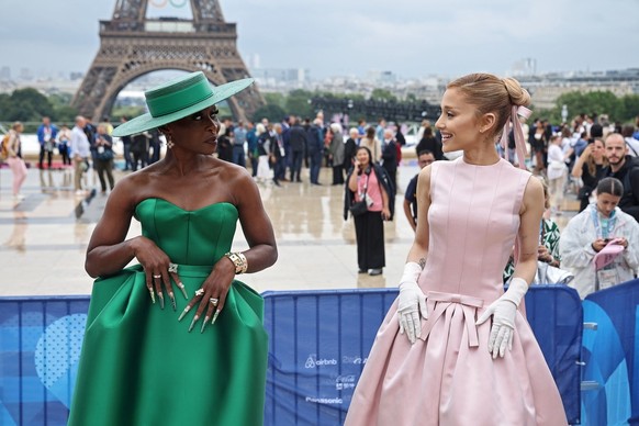 epaselect epa11497343 US actor and singer Cynthia Erivo (L) and US snger Ariana Grande (R) pose for a photo on the red carpet upon arrival for the Opening Ceremony of the Paris 2024 Olympic Games, in ...