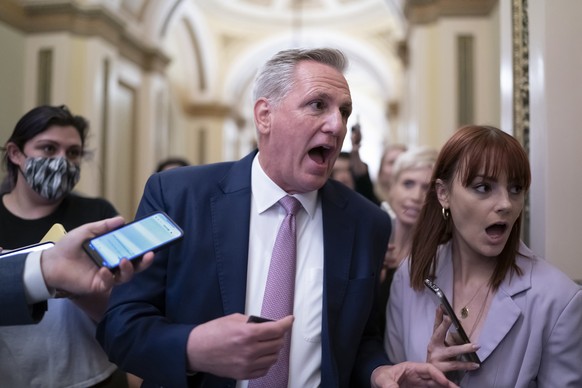 FILE - House Minority Leader Kevin McCarthy, R-Calif., rushes to his office with reporters in pursuit after House investigators issued a subpoena to McCarthy and four other GOP lawmakers as part of th ...