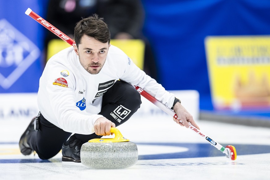 Switzerland&#039;s Benoit Schwarz-Van Berkel delivers a stone against Norway at the World Men&#039;s Curling Championship at the IWC Arena in Schaffhausen, Switzerland on Sunday March 31, 2024. (KEYST ...