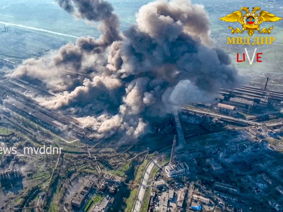 In this handout photo taken from video released on Wednesday, May 4, 2022 by Donetsk People&#039;s Republic Interior Ministry Press Service, Smoke rises from the Metallurgical Combine Azovstal in Mari ...