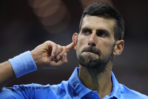 Novak Djokovic, of Serbia, reacts against Alexei Popyrin, of Australia, during a third round match of the U.S. Open tennis championships, Friday, Aug. 30, 2024, in New York. (AP Photo/Julia Nikhinson)
