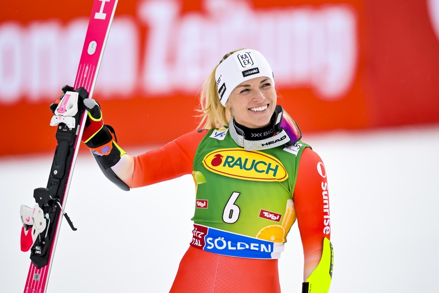 Third placed Lara Gut-Behrami from Switzerland celebrates in the finish are during the second run of the Womens Giant Slalom race of the FIS Alpine Ski World Cup season opener on the Rettenbach glaci ...