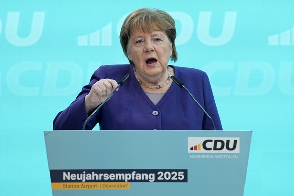 FILE -Former German Chancellor Angela Merkel delivers a speech during a reception of the North Rhine-Westphalian Christian Democratic Union, CDU, in Duesseldorf, Germany, Jan. 18, 2025, ahead of the f ...
