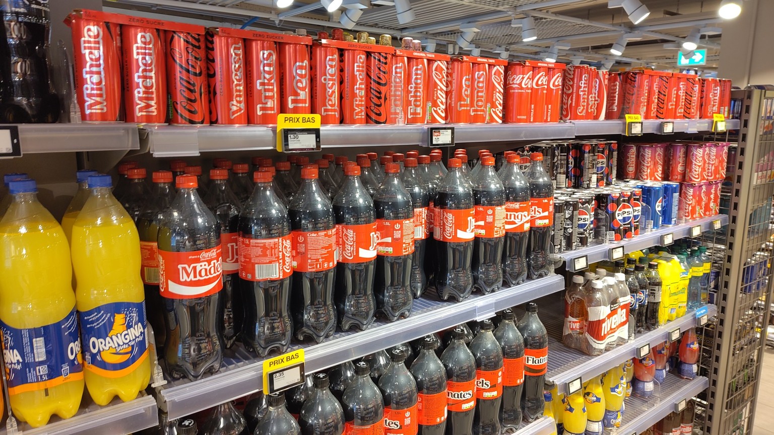 Problème avec les boissons Coca-Cola 5dl à la Migros et la guerre des prix fait rage avec Coop et Aldi. 25 juin 2025.