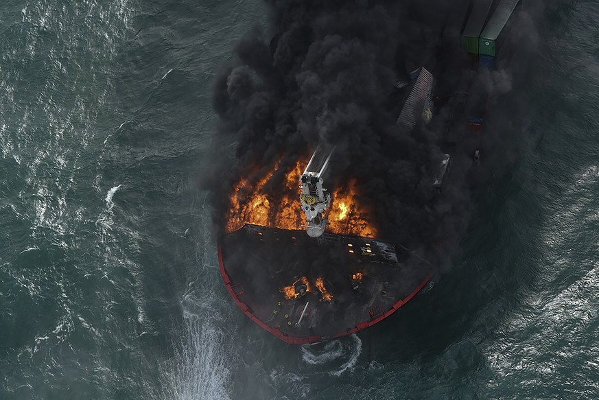 In this photo provided by Sri Lanka Air Force, smoke rises from the container vessel MV X-Press Pearl engulfed in flames off Colombo port, Sri Lanka, Wednesday, May 26, 2021. A fire on a container shi ...