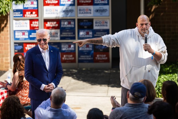 epa11466042 Democratic Senator from Pennsylvania John Fetterman (R) campaigns for US President Joe Biden (L) during a campaign stop at a local AFSCME (American Federation of State, County and Municipa ...