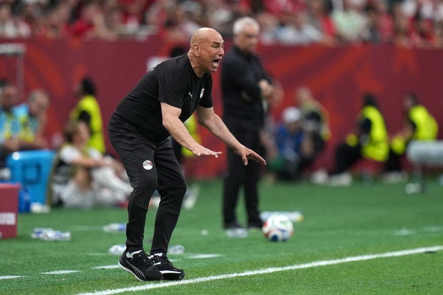 Egypt head coach Hossam Hassan instructs his team from the sidelines during the second half of the World Cup group G soccer match against New Zealand in Vancouver, British Columbia, Sunday, June 21, 2 ...