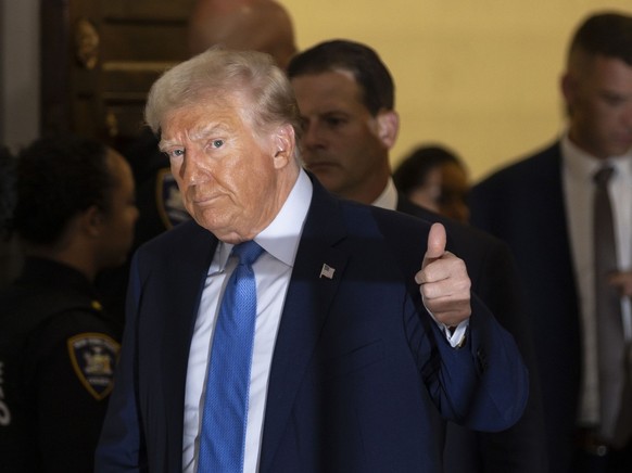epa10960944 Former US president Donald J. Trump exits the courtroom during a break from testifying in the ongoing civil fraud trial being litigated in New York State Supreme Court in New York, New Yor ...