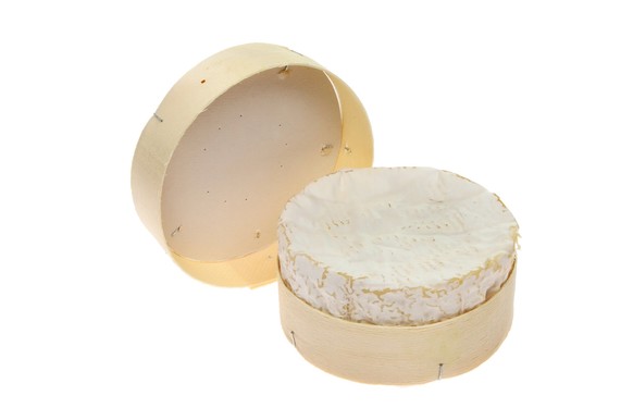 Camembert cheese and packaging isolated against white