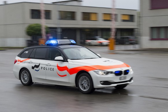Voiture de police du canton de Fribourg. / Police fribourgeoise.