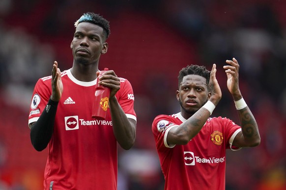 Manchester United&#039;s Paul Pogba, left, and teammate Fred gesture to the crowd following the English Premier League soccer match between Manchester United and Leeds United at Old Trafford in Manche ...