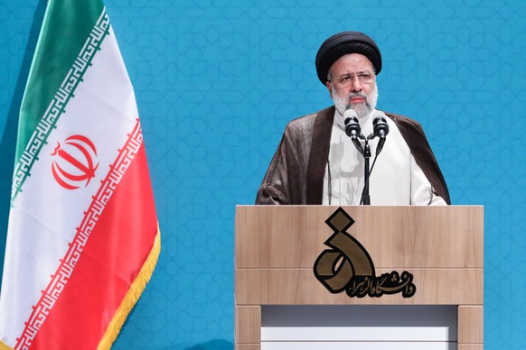 epa10230328 A handout picture made available by the Iranian presidential office shows Iran&#039;s President Ebrahim Raisi speaks to female students during a ceremony marking the beginning of the acade ...