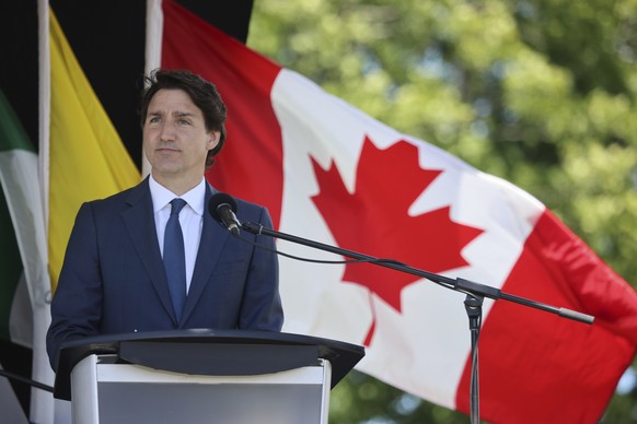 Canadian Prime Minister Justin Trudeau addresses the audience during a national apology to the No. 2 Construction Battalion, in Truro, Nova Scotia, Saturday, July 9, 2022. Hundreds of Black men in Can ...