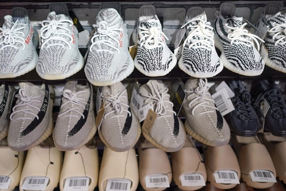 FILE - Yeezy shoes made by Adidas are displayed at Laced Up, a sneaker resale store, in Paramus, N.J., on Oct. 25, 2022. Adidas is releasing a second batch of high-end Yeezy sneakers after cutting tie ...