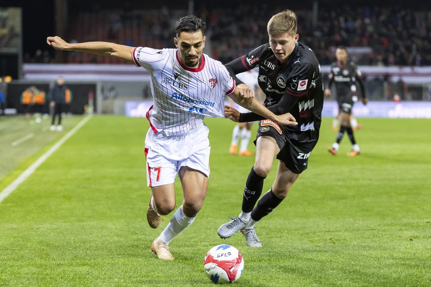 Ilyas Chouaref (SIO), gauche, lutte pour le ballon avec Cyrill May (SG), droite, lors de la rencontre de football de Swiss Super League entre le FC Sion et le FC Saint-Gall ce mardi 28 octobre 2025 au ...
