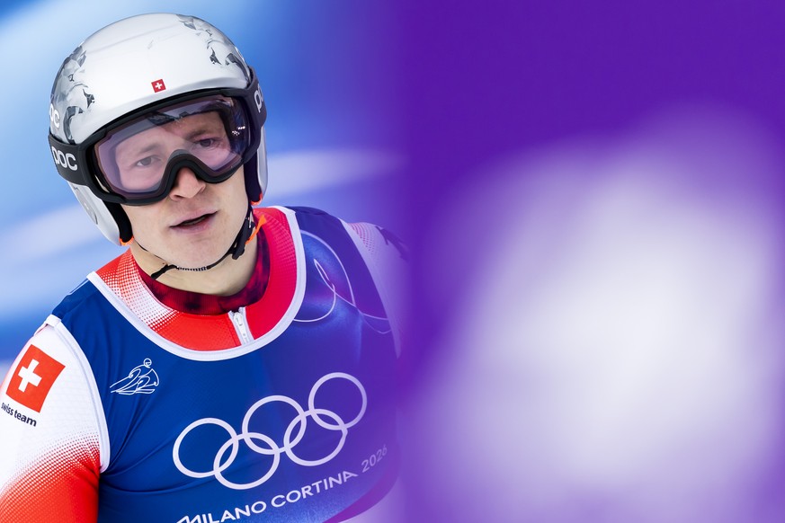 Switzerland's Marco Odermatt reacts in finish area during the men's alpine skiing first run of the giant slalom race at the 2026 Olympic Winter Games at the Stelvio Ski centre in Bormio, Ita ...
