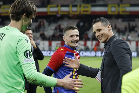 Basel&#039;s president David Degen, right, celebrates with Basel&#039;s goalkeeper Marwin Hitz, left, and captain Taulant Xhaka, after the UEFA Conference League quarter final soccer match between OGC ...