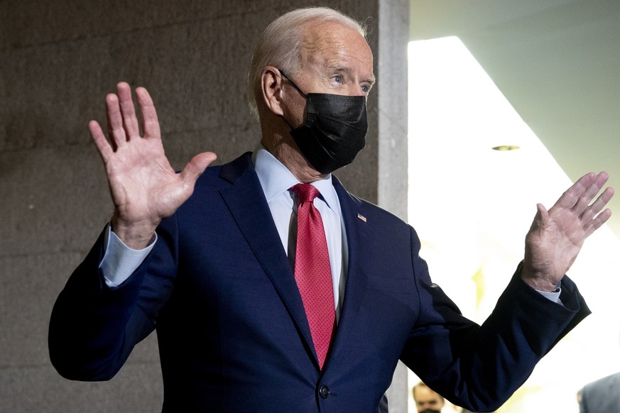 epa09500849 US President Joe Biden gives brief remarks to members of the news media after attending a House Democratic Caucus meeting on Capitol Hill in Washington, DC, USA, 01 October 2021. US Presid ...