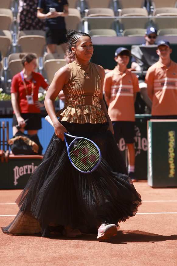 PARIS, FRANCE - MAY 26: Naomi Osaka of Japan enters the court wearing a custom Nike black dress ahead of her first round match against Laura Siegemund of Germany on day 3 of the 2026 French Open, Rola ...