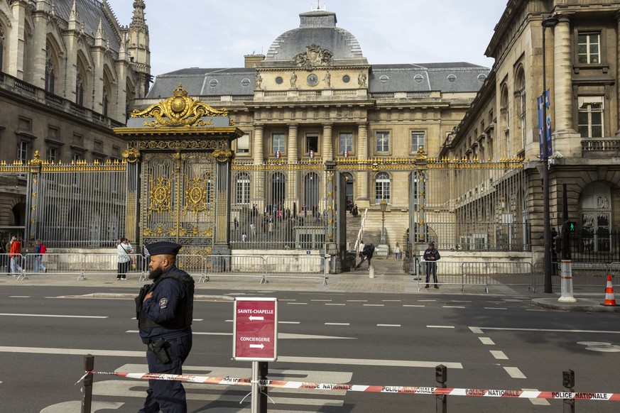 epa11607678 French policemen secure the entrance of Courthouse during the trial of French jihadist Peter Cherif in Paris, France, 16 September 2024. Peter Cherif is a jihadist allegedly linked to the  ...