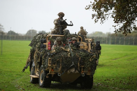 DEREHAM, ENGLAND - NOVEMBER 8: Catherine, Princess of Wales drives sits in an armoured vehicle as she visits The Queen's Dragoon Guards Regiment for the first time as their Colonel in Chief on No ...