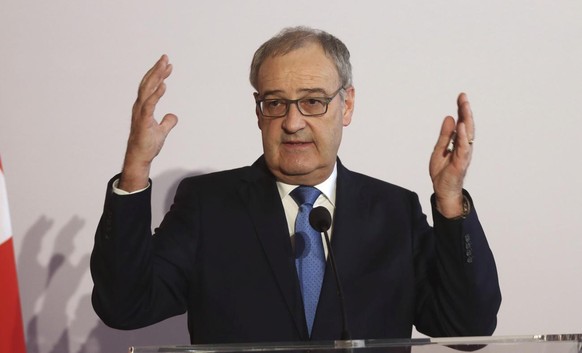 Swiss President Guy Parmelin addresses the media during a joint press conference with Austrian President Alexander Van der Bellen after their meeting in Vienna, Austria, Tuesday, March 2, 2021. (AP Ph ...