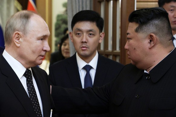 epa11421868 Russian President Vladimir Putin (L) and North Korean leader Kim Jong Un (R) arrive for a meeting at Kumsusan state residence in Pyongyang, North Korea, 19 June 2024. The Russian president ...
