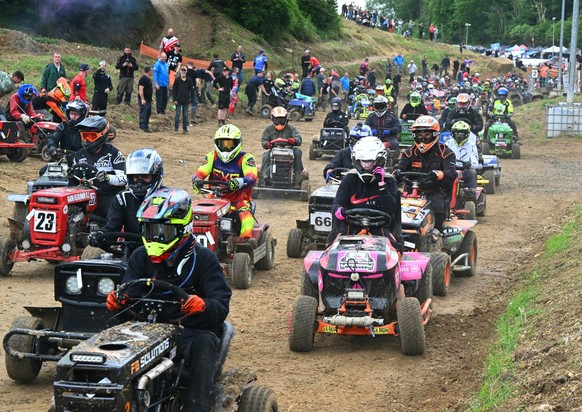 Drivers take the start of the 10th edition of the 24 Hours tractor mower endurance race in Les Petites-Armoises, northeastern France, on June 7, 2025. (Photo by FRANCOIS NASCIMBENI / AFP)