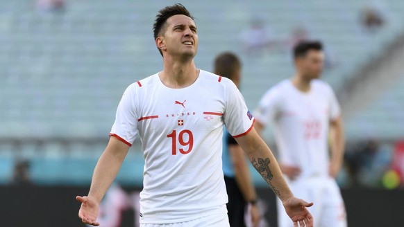 Switzerland&#039;s forward Mario Gavranovic reacts after the cancellation of his goal by the VAR, during the Euro 2020 soccer tournament group A match between Wales and Switzerland at the Olympic stad ...