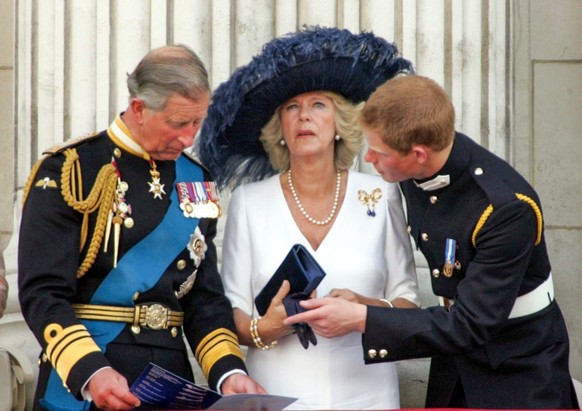 LONDON, ENGLAND - JULY 10: (L-R) Prince Charles, Camilla, Duchess of Cornwall and Prince Harry watch a Battle of Britain Memorial Flight fly-past on Commemoration Day, marking the 60th anniversary of  ...