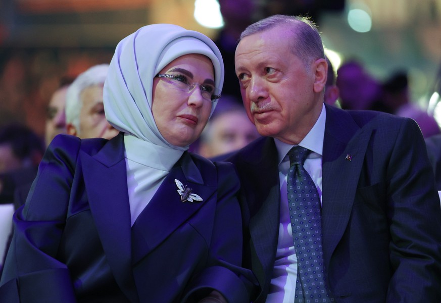 epa11917817 A handout photo made available by the Turkish Presidential Press Office shows Turkish President Recep Tayyip Erdogan (R) and his wife Emine Erdogan (L) attending the 8th Ordinary Congress  ...