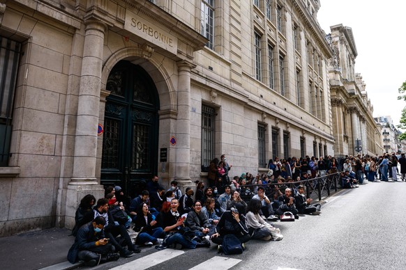epa11309048 Pro-Palestinian demonstrators gather outside the Sorbonne University, where they tried to set up a protest camp before being evacuated by police in Paris, France, 29 April 2024. More than  ...
