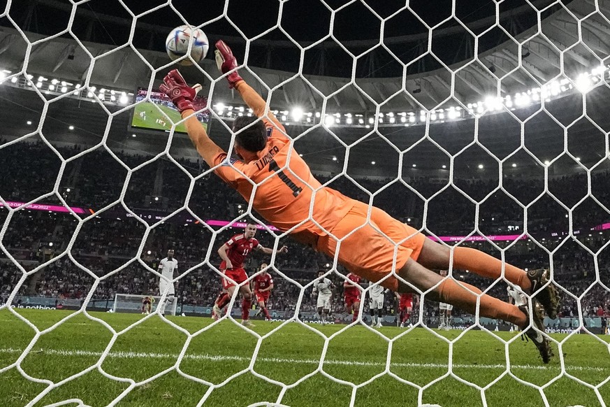 Wales' Gareth Bale scores his side's opening goal from the penalty spot, during the World Cup, group B soccer match between the United States and Wales, at the Ahmad Bin Ali Stadium in in Do ...