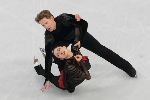 Madison Chock and Evan Bates of the United States compete during the figure skating ice dance team event at the 2026 Winter Olympics, in Milan, Italy, Saturday, Feb. 7, 2026. (AP Photo/Stephanie Scarb ...