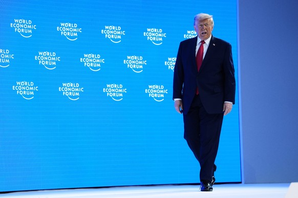 President Donald Trump arrives on stage to address the audience during the Annual Meeting of the World Economic Forum in Davos, Switzerland, Wednesday, Jan. 21, 2026. (AP Photo/Evan Vucci)