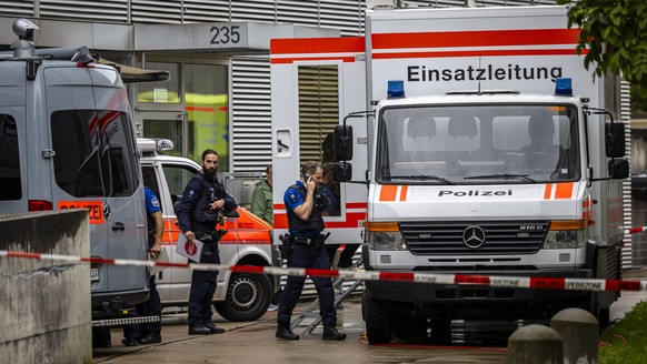 Police officers during an operation outside an after-school care facility in Zurich Oerlikon, Switzerland, on Tuesday, October 1, 2024. A 23-year-old man attacked a group of after-school children with ...