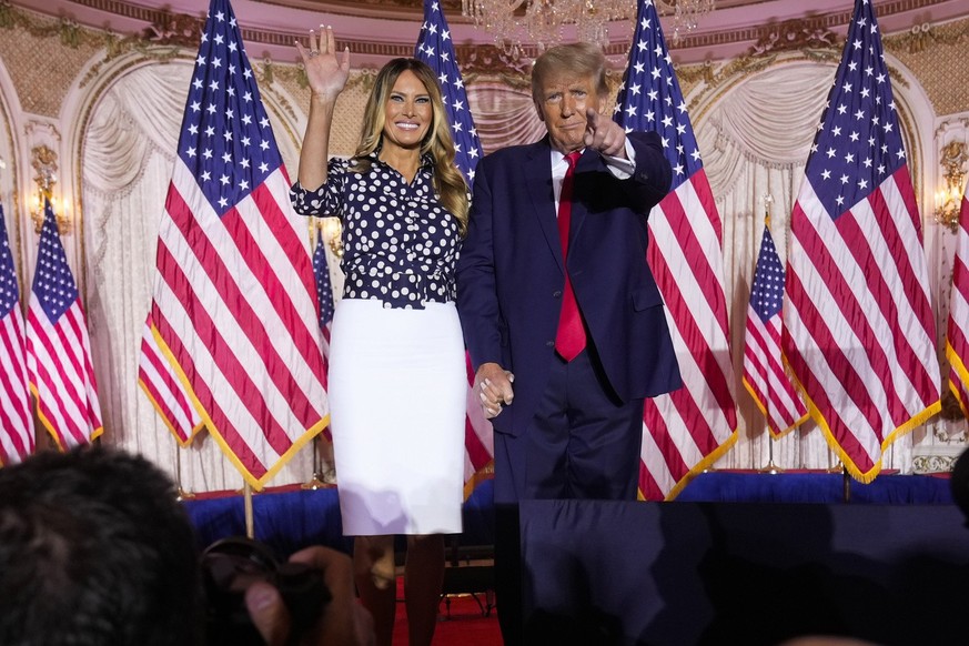 Former President Donald Trump stands on stage with former first lady Melania Trump after he announced a run for president for the third time as he speaks at Mar-a-Lago in Palm Beach, Tuesday, Nov. 15, ...
