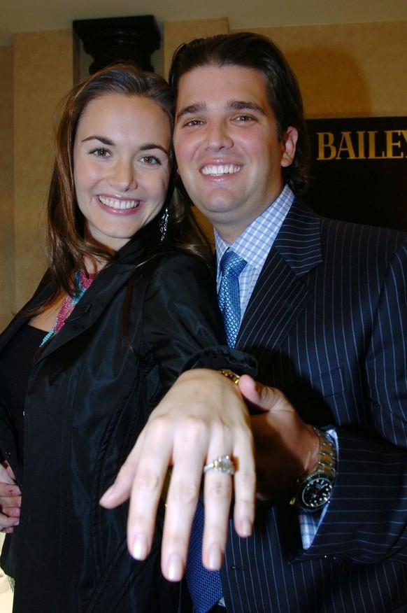 UNITED STATES - NOVEMBER 11: Donald Trump Jr. holds up the hand of his fiancee, actress-model Vanessa Haydon, the better to see the 4-carat diamond engagement ring he gave her at a jewelry shop in a S ...