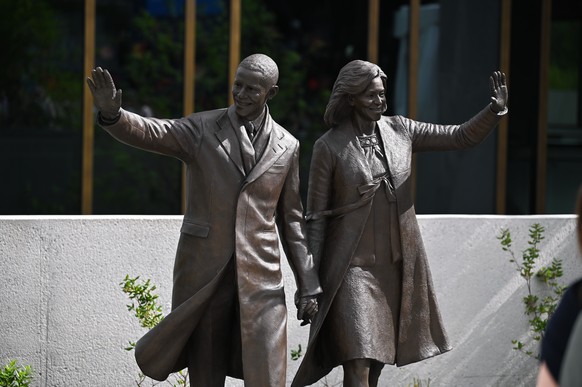epa13046943 A bronze statue of former President Barack Obama and former first lady Michelle Obama holding hands and waving is pictured on display during the press preview at the Obama Presidential Cen ...
