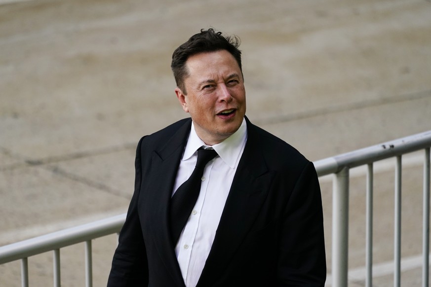 Elon Musk walks from the the justice center in Wilmington, Del., Monday, July 12, 2021. Musk took to a witness stand Monday to defend his company&#039;s 2016 acquisition of a troubled company called S ...